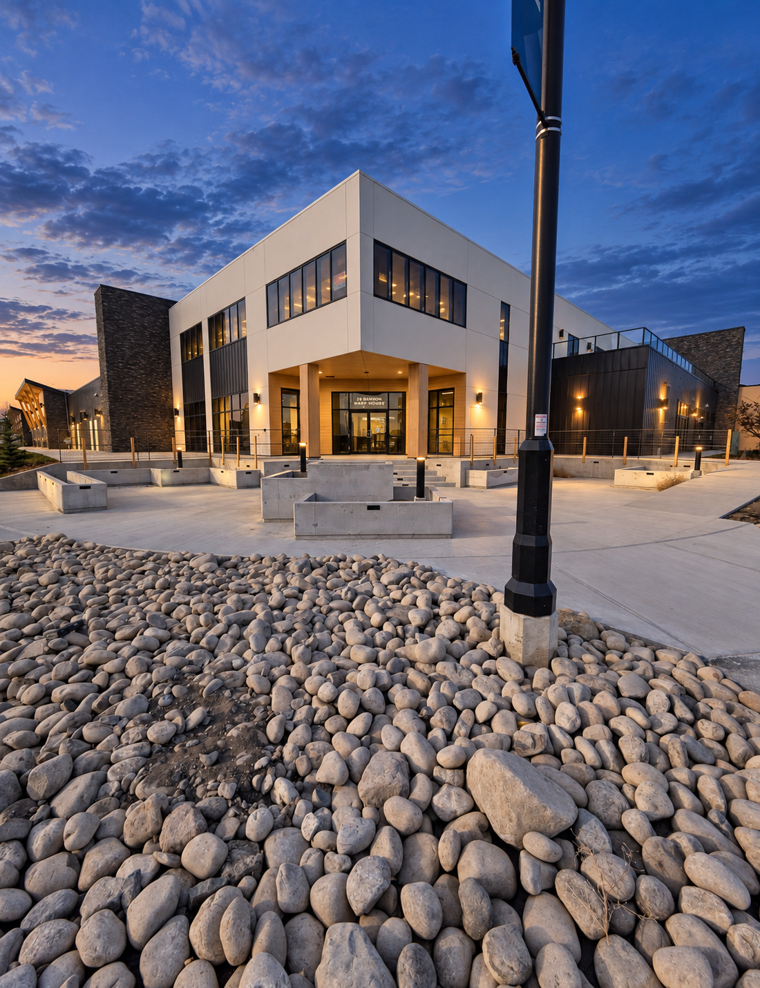 Modern commercial building and plaza at blue hour