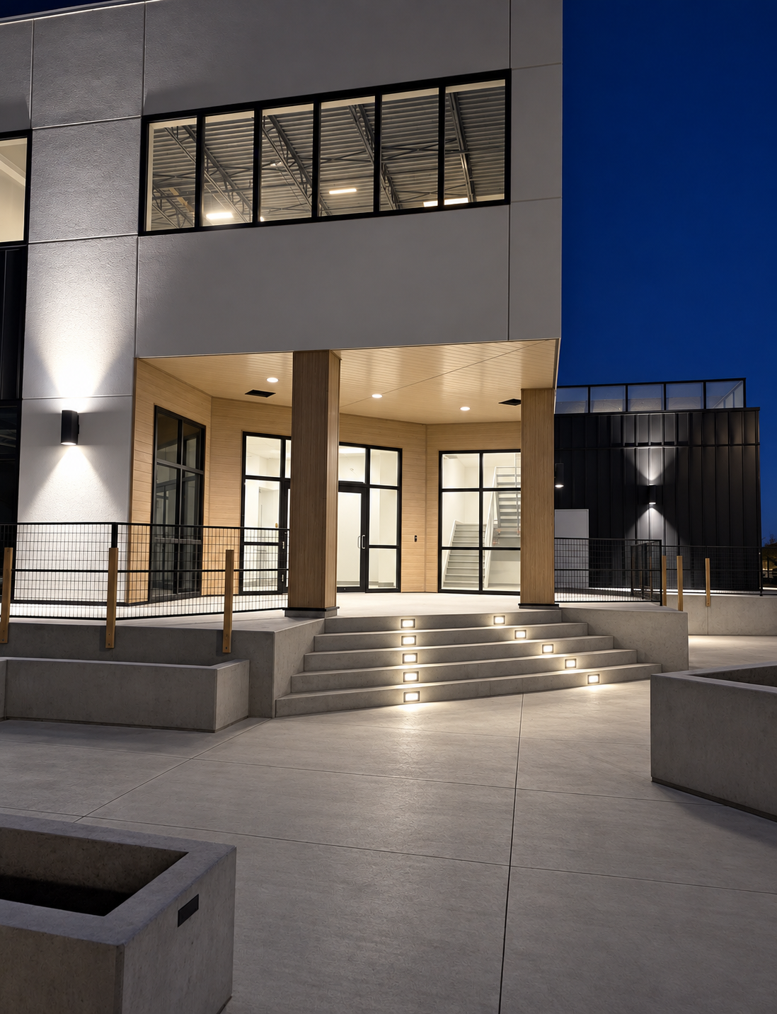 Completed commercial entrance with fully illuminated architectural step lighting